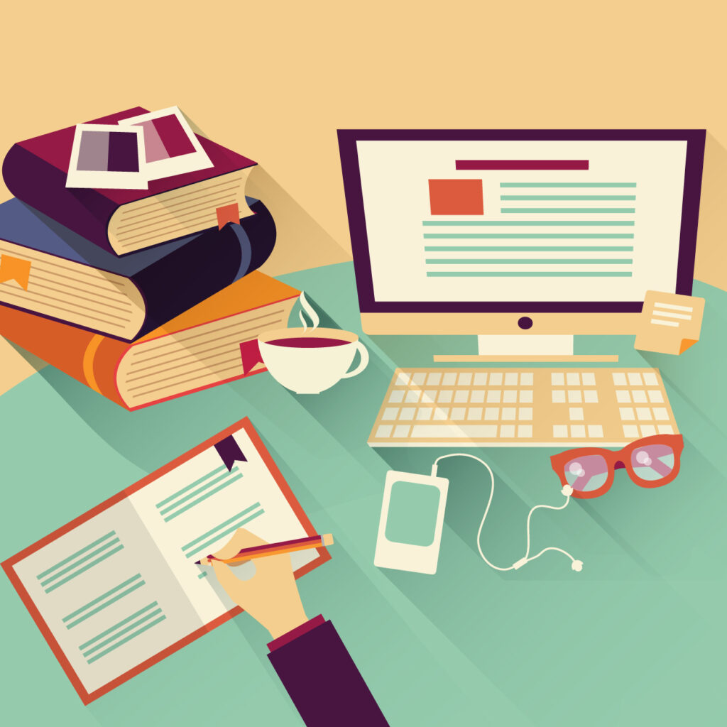 Book editing process with notebook, books and computer